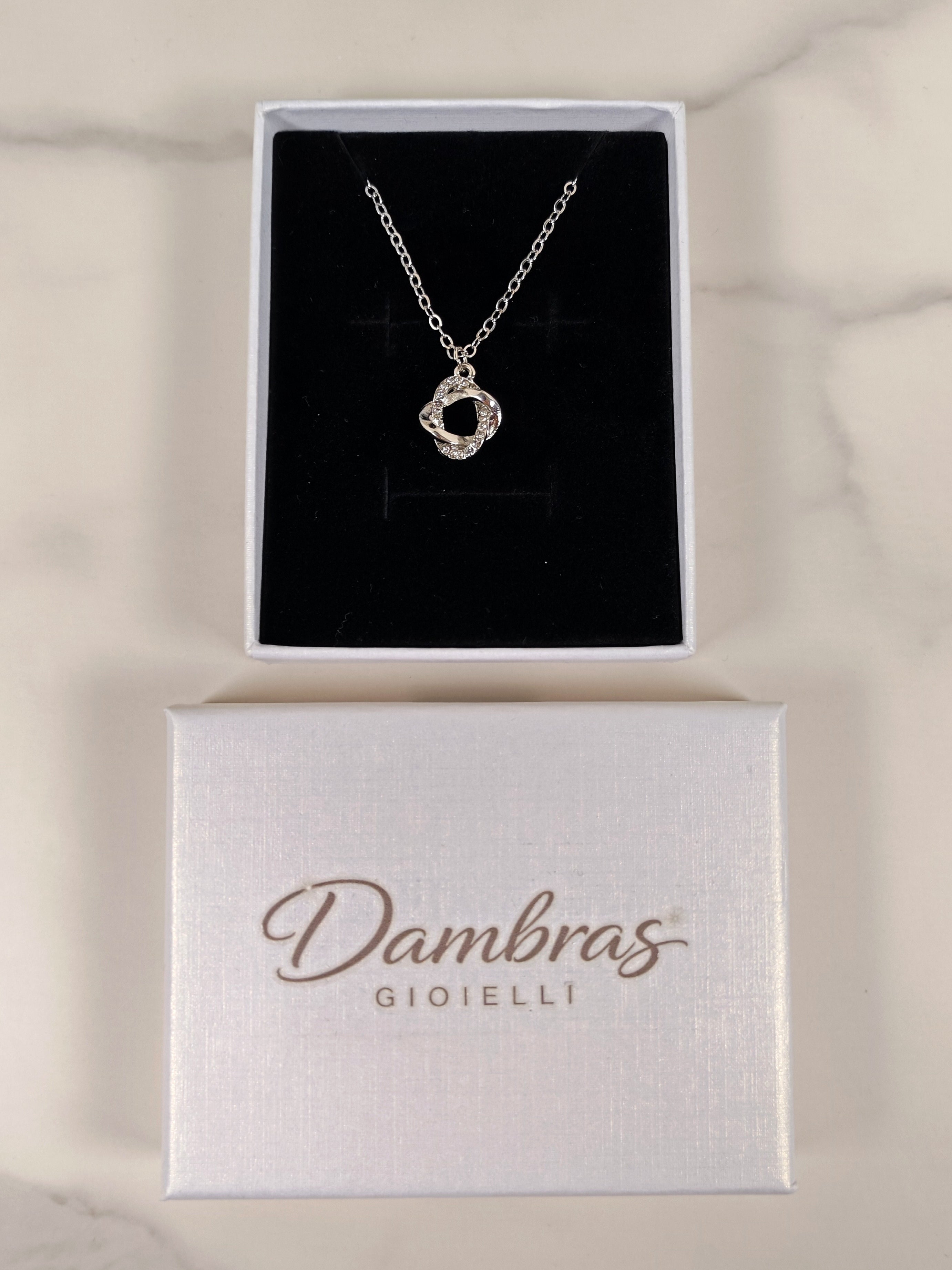 Collana Incrocio di Luce in Metallo Argentato e Zirconi Brillanti